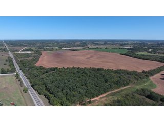 SW VIEW - SIGNIFICANT LAND & PRODUCING MINERALS AUCTION - 237 +/- SURFACE ACRES IN 4 TRACTS - 18 MINERAL PACKAGES IN GARVIN, MCCLAIN, GRADY & ROGER MILLS COUNTIES, OK - 6 Mo. AVG. CASH FLOW of $196,376/Mo.